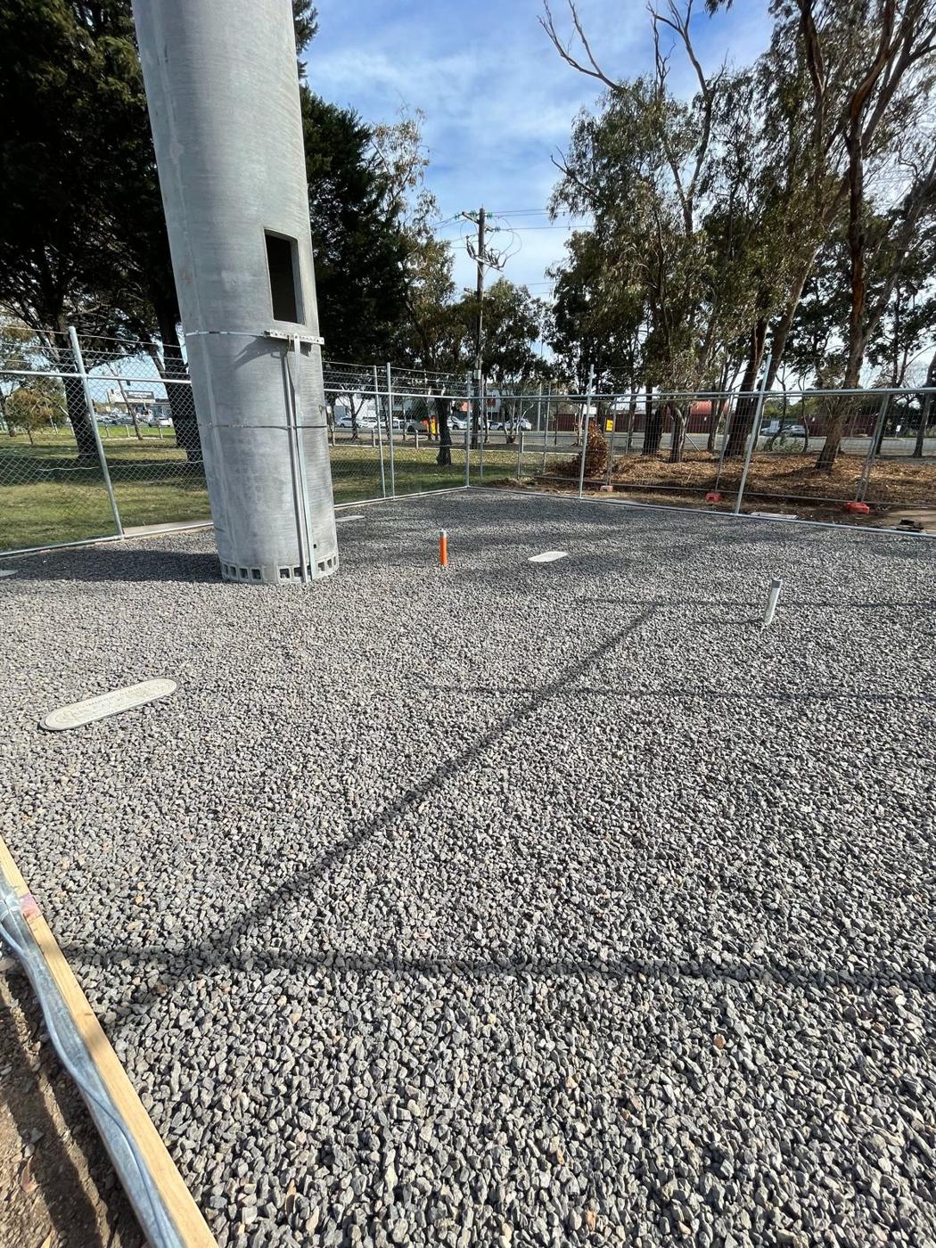 Finished tower compound with crushed rock and fencing